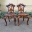 An Antique Victorian Pair of Heavily Carved Wooden Hall Chairs