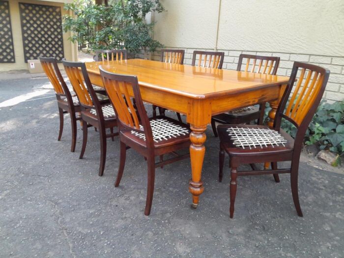 A Late 19thCentury  Early 20th Century Yellowwood Dining Table  with A 20th Century Set of Eight (8) Cape Stinkwood and Yellowwood Riempie Dining Chairs - Image 2