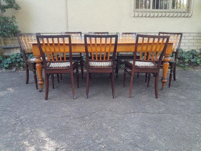 A Late 19thCentury  Early 20th Century Yellowwood Dining Table  with A 20th Century Set of Eight (8) Cape Stinkwood and Yellowwood Riempie Dining Chairs - Image 4