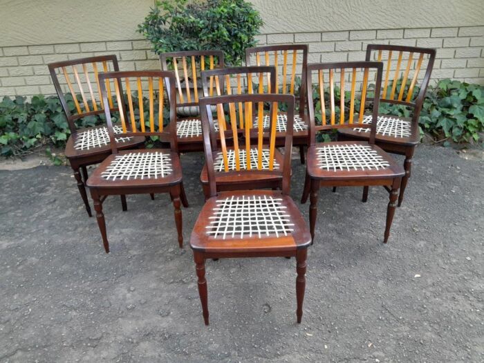 A Late 19thCentury  Early 20th Century Yellowwood Dining Table  with A 20th Century Set of Eight (8) Cape Stinkwood and Yellowwood Riempie Dining Chairs - Image 5