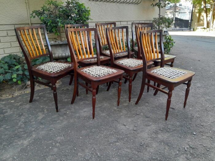 A Late 19thCentury  Early 20th Century Yellowwood Dining Table  with A 20th Century Set of Eight (8) Cape Stinkwood and Yellowwood Riempie Dining Chairs - Image 6