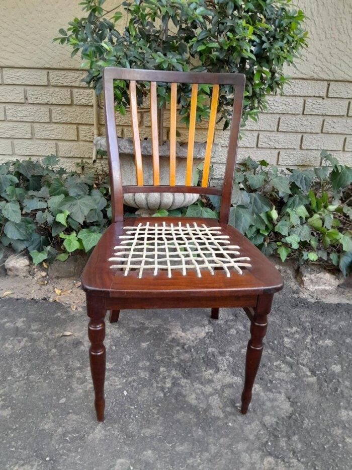 A Late 19thCentury  Early 20th Century Yellowwood Dining Table  with A 20th Century Set of Eight (8) Cape Stinkwood and Yellowwood Riempie Dining Chairs - Image 9