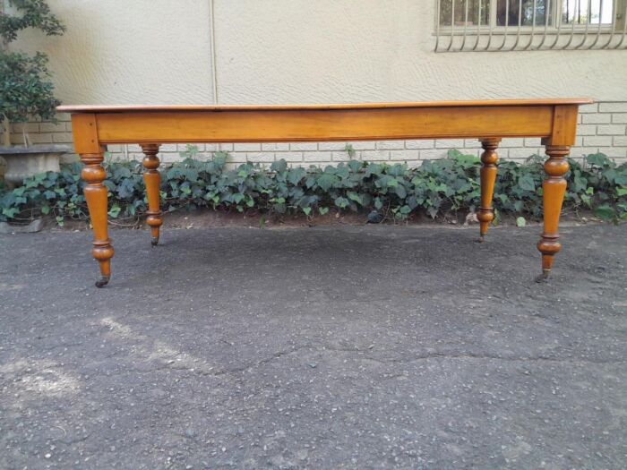 A Late 19thCentury  Early 20th Century Yellowwood Dining Table  with A 20th Century Set of Eight (8) Cape Stinkwood and Yellowwood Riempie Dining Chairs - Image 13