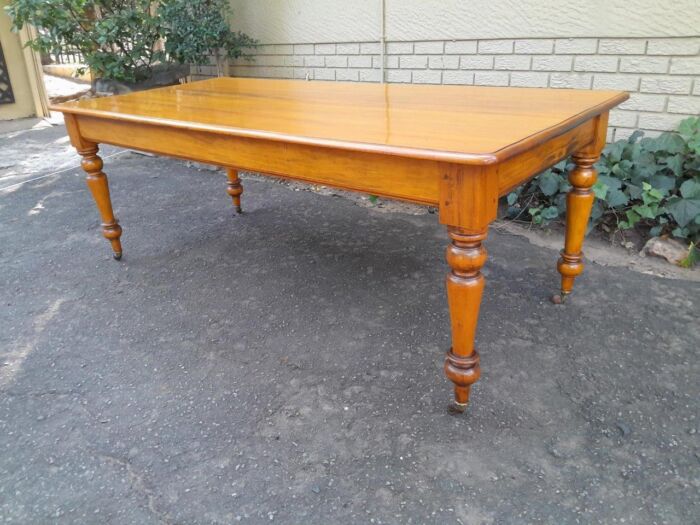 A Late 19thCentury  Early 20th Century Yellowwood Dining Table  with A 20th Century Set of Eight (8) Cape Stinkwood and Yellowwood Riempie Dining Chairs - Image 14