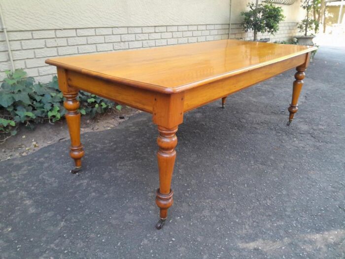A Late 19thCentury  Early 20th Century Yellowwood Dining Table  with A 20th Century Set of Eight (8) Cape Stinkwood and Yellowwood Riempie Dining Chairs - Image 15