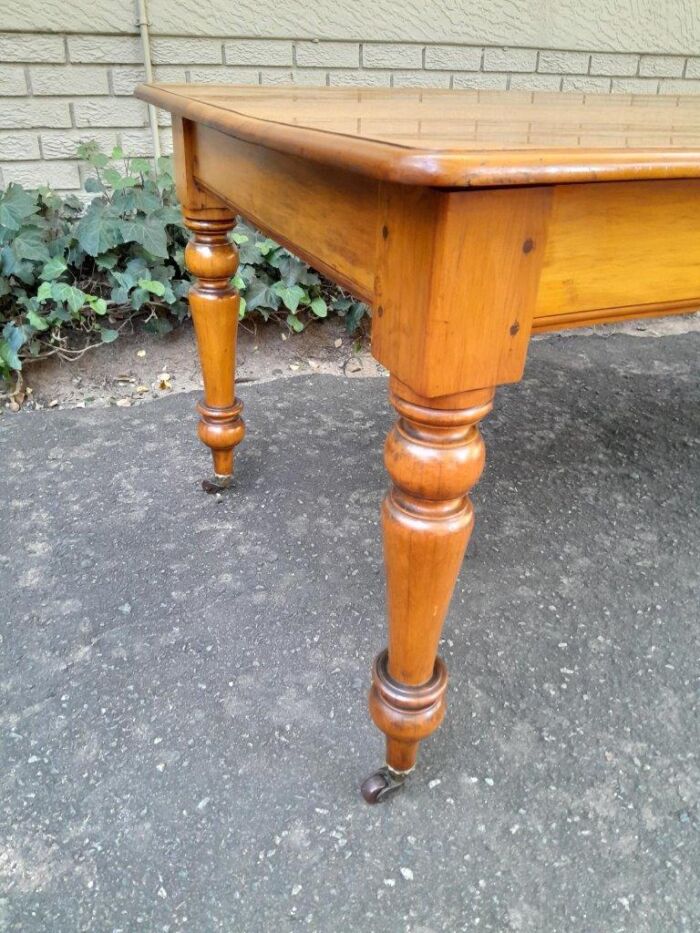 A Late 19thCentury  Early 20th Century Yellowwood Dining Table  with A 20th Century Set of Eight (8) Cape Stinkwood and Yellowwood Riempie Dining Chairs - Image 16