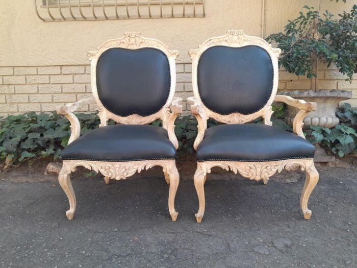 A 20th Century Pair Of French Style Carved Oak Armchairs In A Contemporary Bleached Finish And Upholstered In Leather - Image 2