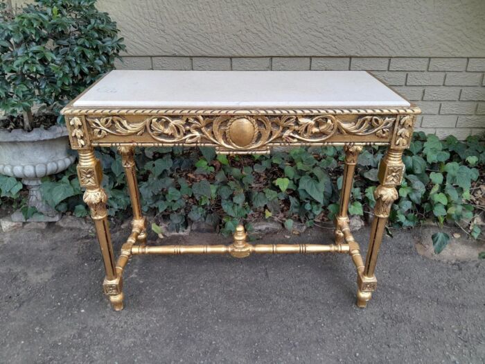 A 20th Century Ornately Carved and Hand-Gilded Console Table with Cream Marble Top - Image 2