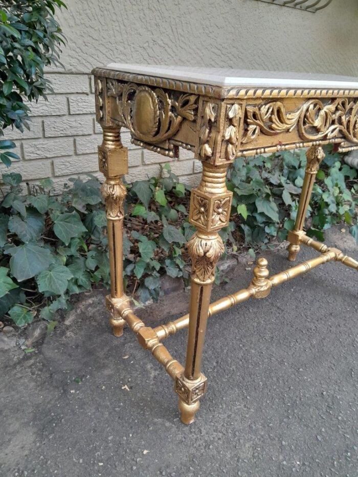 A 20th Century Ornately Carved and Hand-Gilded Console Table with Cream Marble Top - Image 7