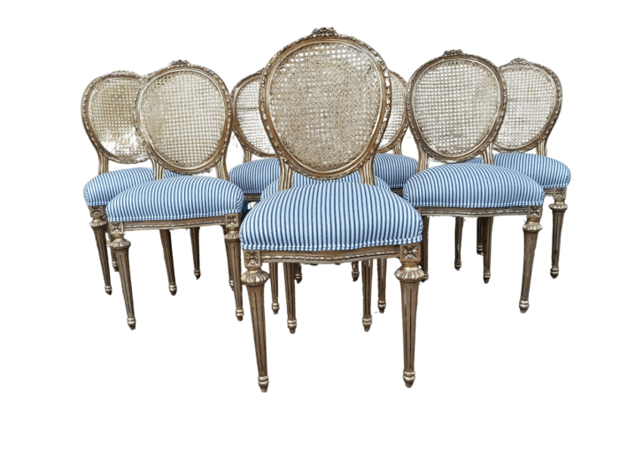 A Set of Eight French Style Carved Balloon and Rattan Back Chairs Upholstered in a Contemporary Fabric