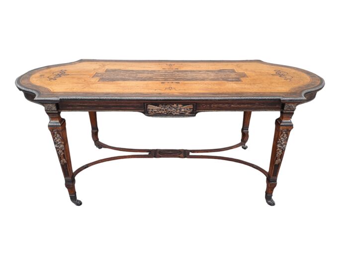 A Napoleon Marquetry Table On Castors