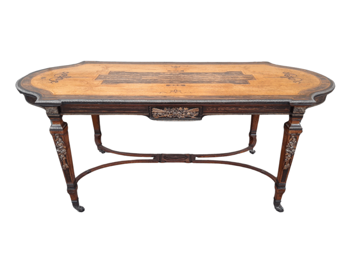 A Napoleon Marquetry Table On Castors