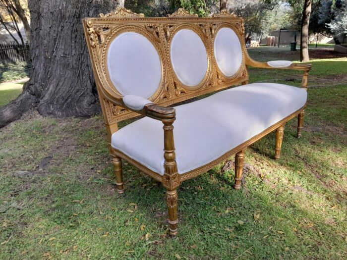 A 20th Century French Style Ornately Carved Gilt Wood Set Comprising a Settee and Pair of Armchairs - Image 10