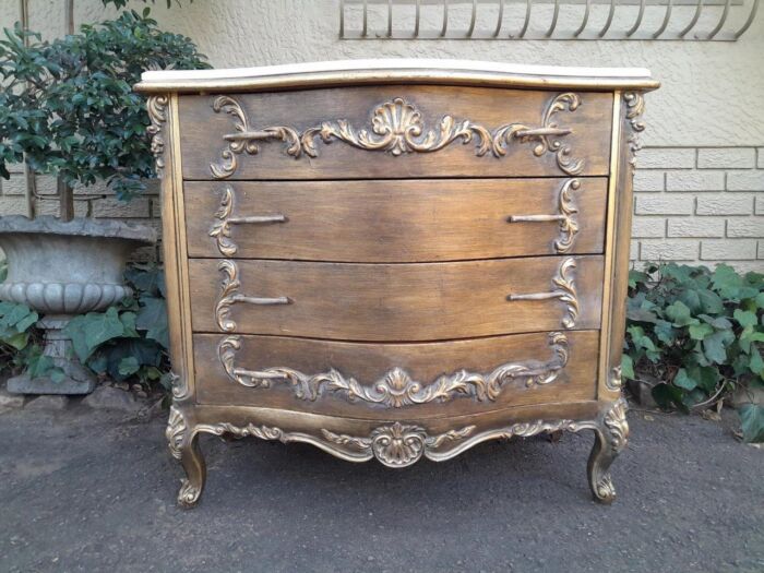 A French Style Ornate and Gilded Chest of Drawers with Marble Top
