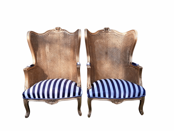 A Pair of 20th Century French Style Gilt Wood Arm Chairs with Rattan Back