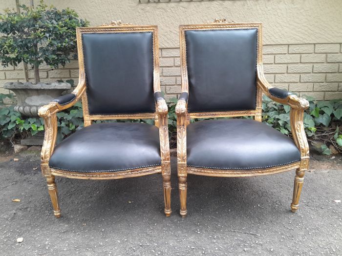 A 20th Century French Style Pair of Carved Gilt-Wood Arm Chairs Upholstered in Black Leather - Image 2