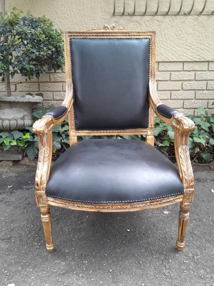 A 20th Century French Style Pair of Carved Gilt-Wood Arm Chairs Upholstered in Black Leather - Image 6