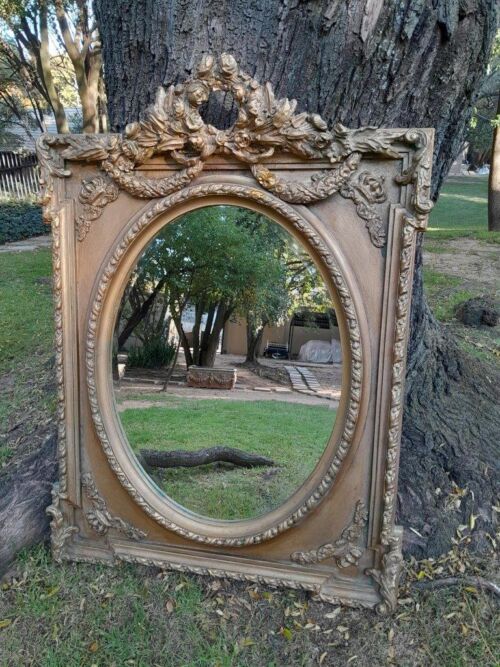 A French Rococo Style Ornately Carved & Gilded Bevelled Mirror