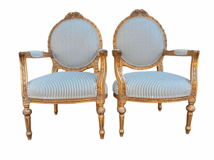 A 20TH Century French Style Pair Of Ornately Carved Giltwood Armchairs