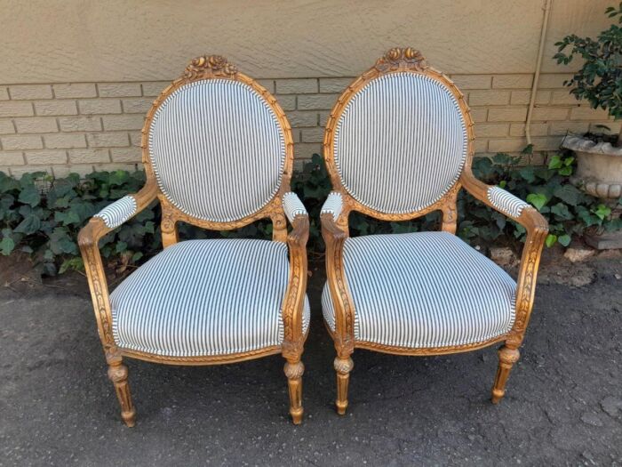 A 20TH Century French Style Pair Of Ornately Carved Giltwood Armchairs - Image 3