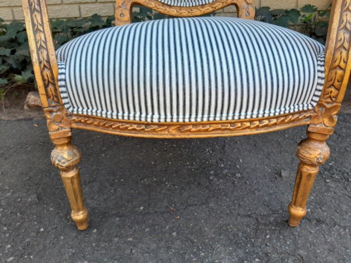 A 20TH Century French Style Pair Of Ornately Carved Giltwood Armchairs - Image 8