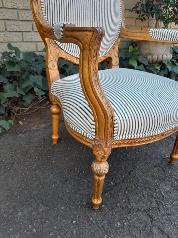A 20TH Century French Style Pair Of Ornately Carved Giltwood Armchairs - Image 9