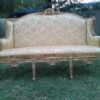 An Early 20th Century French Style Ornately Carved and Gilded Wingback Settee 