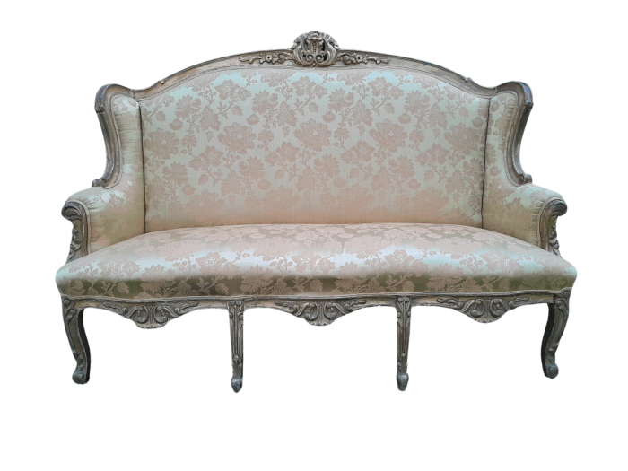 An Early 20th Century French Style Ornately Carved and Gilded Wingback Settee 
