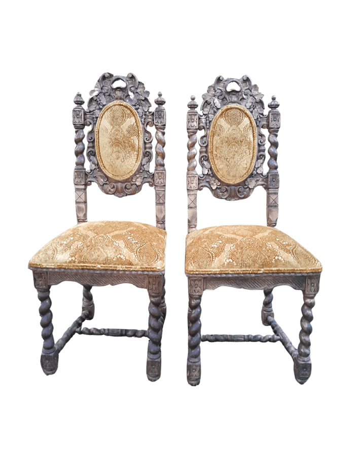 A Pair of 19th Century French Ornately Carved and Gilded Chairs