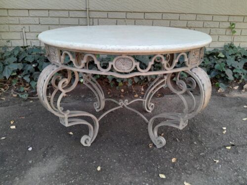 A 20th Century French Style Wrought Iron Circular Table with Cream Top