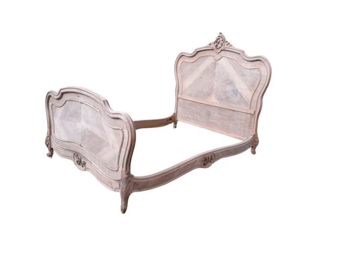 A 20TH Century Walnut Rococo Style Bed in a Contemporary Bleached Finish