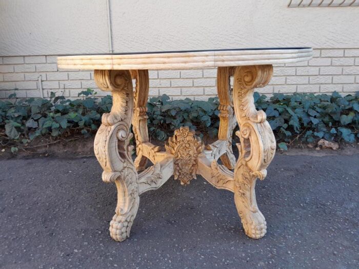 A 20th Century Ornately Carved Circular Wooden Table In A Contemporary Bleached Finish And With A Bevelled Mirror Top - Image 2