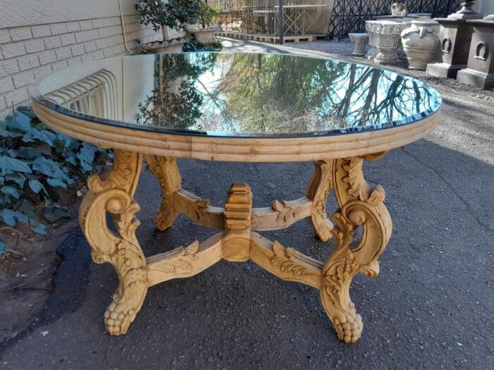 A 20th Century Ornately Carved Circular Wooden Table In A Contemporary Bleached Finish And With A Bevelled Mirror Top - Image 6