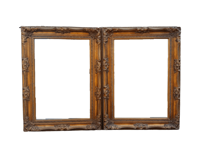 A 20th Century French Style Pair of Large and Ornately Carved Giltwood Mirrors
