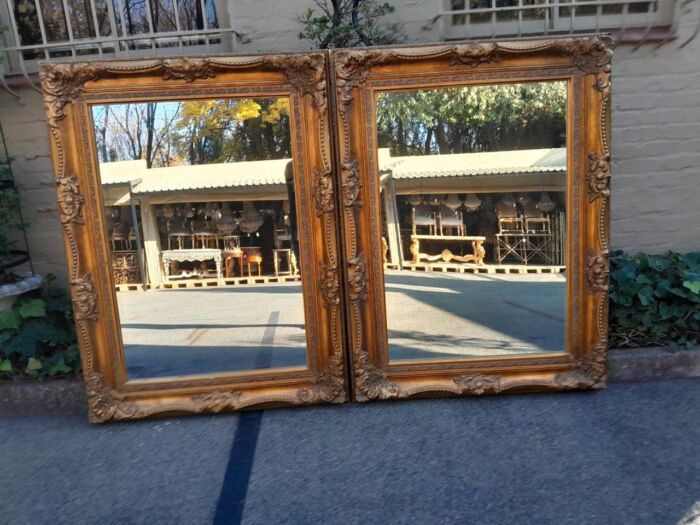A 20th Century French Style Pair of Large and Ornately Carved Giltwood Mirrors - Image 3