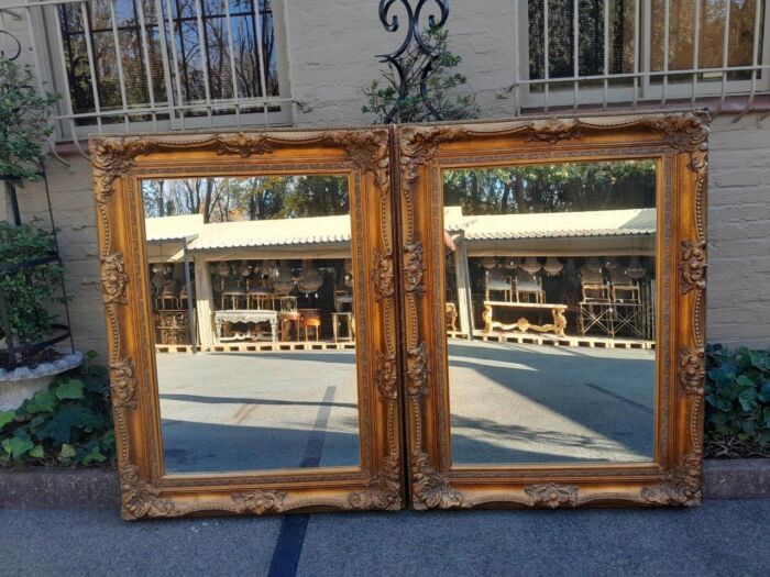 A 20th Century French Style Pair of Large and Ornately Carved Giltwood Mirrors - Image 4
