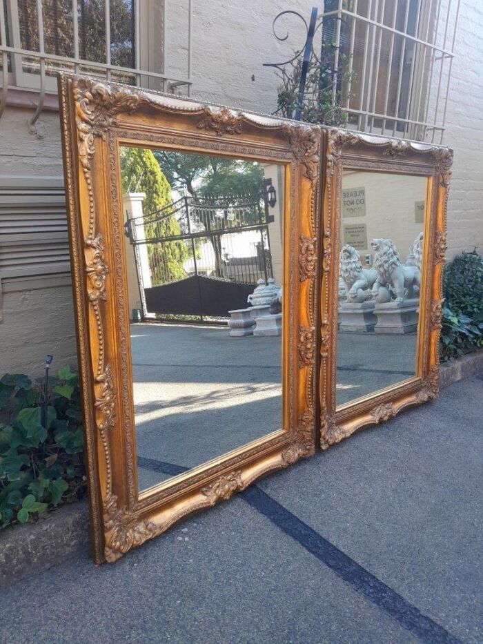 A 20th Century French Style Pair of Large and Ornately Carved Giltwood Mirrors - Image 6