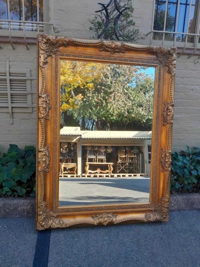 A 20th Century French Style Pair of Large and Ornately Carved Giltwood Mirrors - Image 7