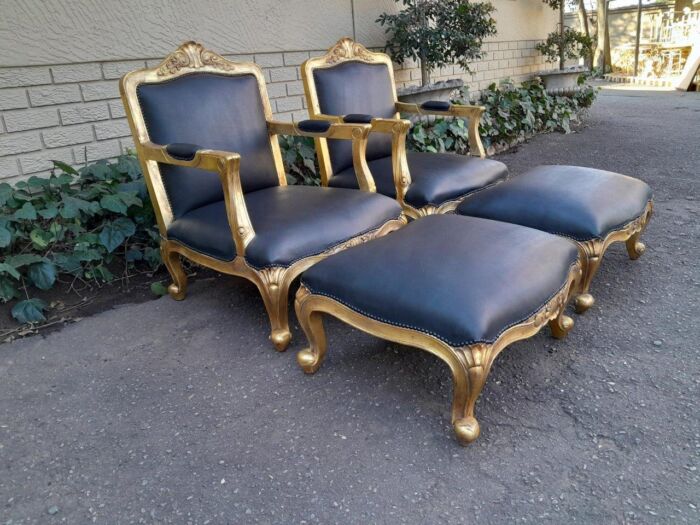 A 20th Century Near Pair  Of Victorian Style Hand-Gilded Mahogany Armchairs And Ottomans Upholstered In Leather - Image 3