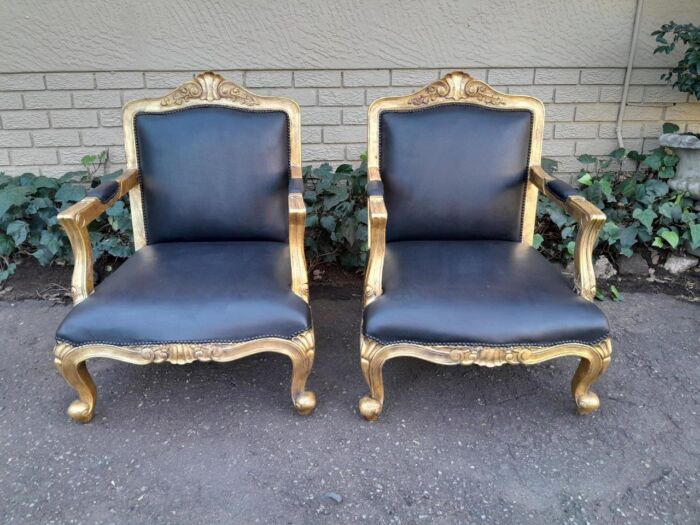 A 20th Century Near Pair  Of Victorian Style Hand-Gilded Mahogany Armchairs And Ottomans Upholstered In Leather - Image 4
