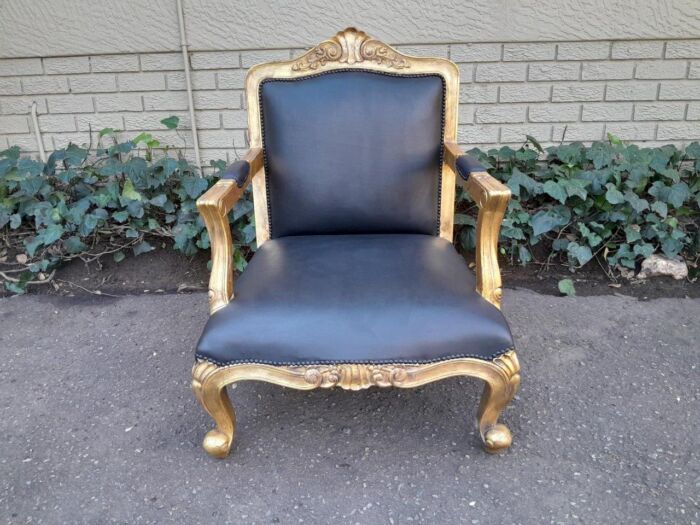 A 20th Century Near Pair  Of Victorian Style Hand-Gilded Mahogany Armchairs And Ottomans Upholstered In Leather - Image 5