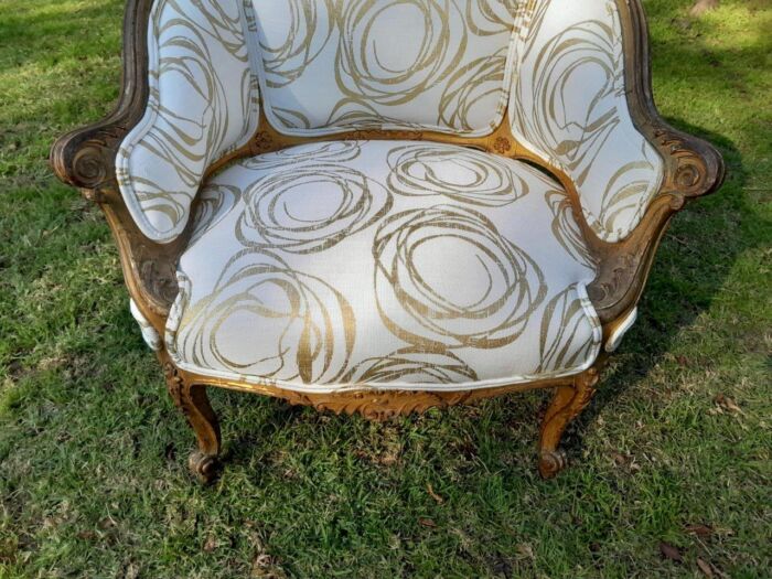 A Late 19th Century French Carved and Gilt Wood Walnut Bergere Armchair  Upholstered in  a custom made fabric for The Crown Collection - Image 9