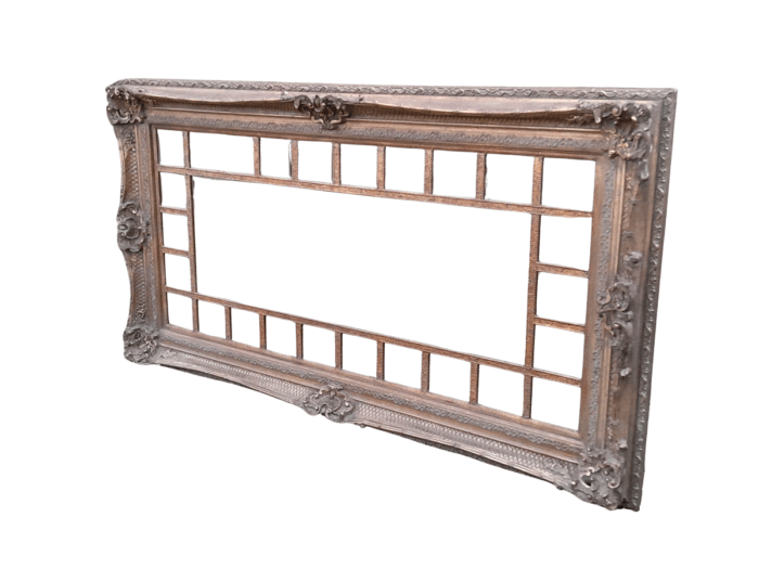 A 20th Century French Style Ornately Carved, Gilt Painted And Bevelled Mirror Of Large Proportions
