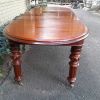 A 19th Century Antique Victorian Mahogany Extending Dining Table with Heavily Carved Legs on Brass Castors - Image 5
