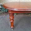 A 19th Century Antique Victorian Mahogany Extending Dining Table with Heavily Carved Legs on Brass Castors - Image 9