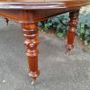 A 19th Century Antique Victorian Mahogany Extending Dining Table with Heavily Carved Legs on Brass Castors - Image 8