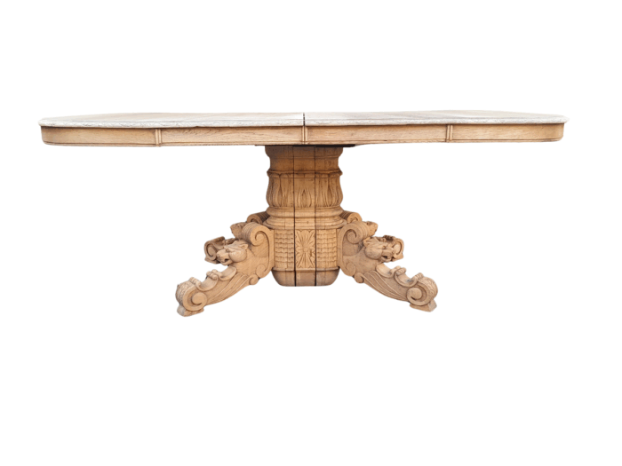 A 19th Century Heavily Carved Oak Extending Table  With Three Extensions