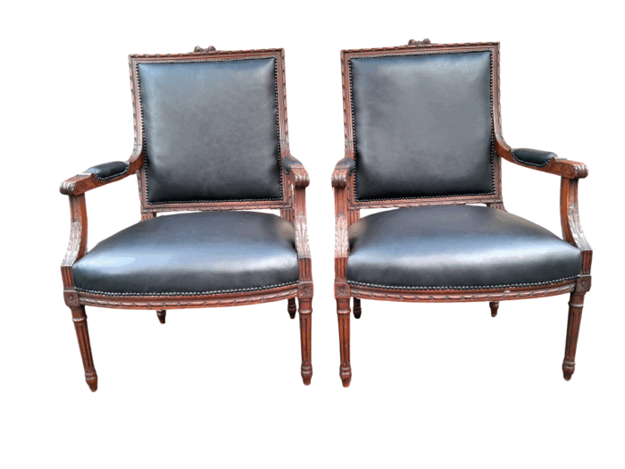 A 19th Century French Pair of Carved Walnut Armchairs Upholstered in  Leather