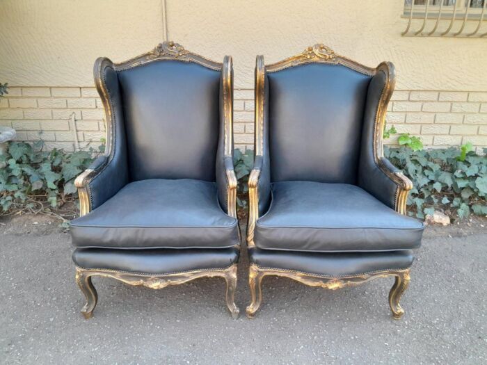 A Circa 1900s French Style Pair Of Carved Giltwood Wingback Chairs Upholstered In Leather - Image 2