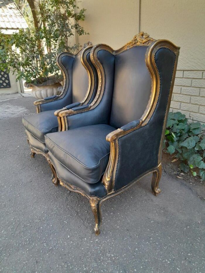 A Circa 1900s French Style Pair Of Carved Giltwood Wingback Chairs Upholstered In Leather - Image 3